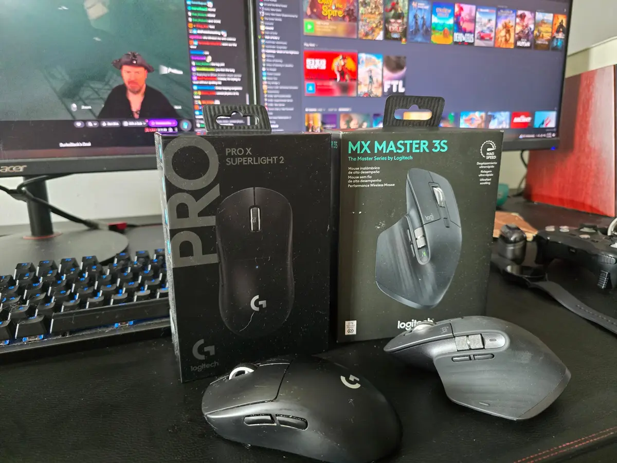 Logitech Superlight 2 and MX Master 3S mice on WFH desk with monitors